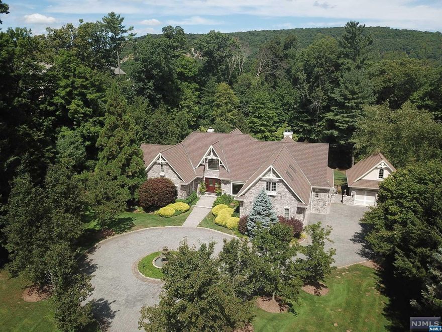 SPECTACULAR MANOR HOME. Very private & quiet 1.84 acre lot in a cul-de-sac in Rio Vista Estates. Setting is second-to-none with a resort-style yard which has a 3-year old gunite pool & spa. Meticulously kept home offers an open floor plan with beautiful architectural detailing. Enter into the grand foyer that leads to the Great Room with a fireplace & wall of windows overlooking the property. Warm & inviting den/sitting room with a fireplace & built-ins. Formal Dining Room. Newer kitchen, upscale appliances & high-end finishes. Off the kitchen is a family room with fireplace. Private primary suite, lavish bath & an additional room which can be used as a gym, office, etc. 2nd level offers a secondary primary suite with full bath & 2 additional bedrooms & baths. Lower level is walkout with family room, fireplace & butler's kitchen, full bath & cedar closet. Newer multi-level maintenance free deck with hot tub for year-round use. 4 car garage, paver driveway, security, generator.