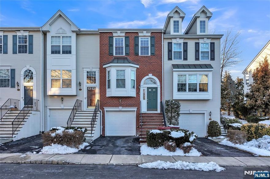 Welcome to this meticulously maintained 2-bedroom, 2.5-bath townhome nestled in the prestigious gated community of Cambridge Heights, conveniently located 9 miles from NYC. This beautifully light-filled residence boasts an ideal East/West exposure, ensuring abundant natural light throughout the day. Upon entering, you will be greeted by a modern kitchen featuring stainless steel appliances, elegant granite countertops, and a stylish tile backsplash, seamlessly flowing into a cozy breakfast area. The spacious living & dining room with gleaming wood floors leads to a private walk-out patio. 2nd fl offers a luxurious master BR complete with an en-suite bath, highlighted by a stunning travertine tile shower with a frameless glass door. The 2nd BR provides ample storage with 2 closets. 2nd full bath updated tile (2012). For added convenience, a new LG full-size washer & dryer is located on this floor. The lower-level family room offers versatile space, ideal for a home office, entertainment area, gym, or guest room. Recessed lighting & ceiling fans throughout. Recent upgrades include energy-efficient windows (2021) & HVAC (2018). Residents enjoy a wealth of amenities: clubhouse, tennis courts, inground pool, & exercise room. Community features a playground & jogging path. With EZ access to trans, maj highways, shopping, dining, & parks, this townhome presents an exceptional opportunity for refined living. Don't miss your chance to make this exceptional property your new home!