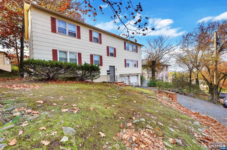 Spacious 2 Family on oversized 70x120 property. First floor and Second Floor Apartments offer the same layout featuring Living Room, Dining Room, Kitchen, Main Bedroom, Ensuite Bath with Shower, 2 additional Large Bedrooms, and a Full Bath with Tub and Overhead Shower. Hardwood Floors Throughout. First Floor Apartment Corian Counters and Backsplash updated 2015. Separate Electric Baseboard Heat, Separate Central A/C, Separate Water. Large Two Car Garage. Large Yard. Professionally Landscaped. New Roof and Steps 2021. First Floor HVAC System was replaced in July 2019 with a new 3 Ton Payne condensing unit and a new 3 Ton Air Handler. 2 Laundry Rooms. Approx 2704 Sq Ft as per tax records. Excellent residential location high on the hill.