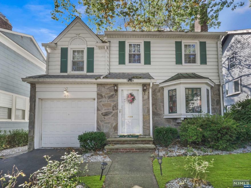 Welcome Home to this Classic Side Hall Colonial in prestigious Glen Ridge. This home has everything you need and offers plenty of light. Inviting entry with a hall closet and an easy floor plan. Living room w/ gas fireplace and a bay window, oversized dining room with a screened-in porch for entertaining in the summer months. Large kitchen with plenty of pantry space. Hardwood floors throughout the first and second levels. The 1st bedroom is up a small flight of stairs separate from the other 2 bedrooms for added privacy. The main bathroom is oversized. Walk-up attic and a super clean full unfinished basement for a rec room, laundry, and storage. One car garage and a private level lot. Conveniently located near NYC train, bus, schools, parks, town pool, restaurants, and shops.