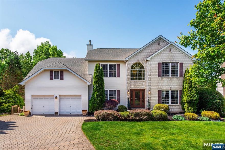 Experience this incredible In-Law Suite Center Hall Colonial home situated in highly sought-after Morris Knolls Regional School District in Crown Heights Section. A strollable sidewalk neighborhood located on a cul-de-sac in Rockaway Township. Upon entry you are greeted by a soaring 2-Story Foyer leading to an Open-Concept Floor Plan featuring a Great Room Living Room with Wood-Burning Fireplace & Skylights, Eat-In Kitchen including high-end Granite Countertops, Sub-Zero refrigerator & Stainless Steel Appliances, Office space accented by French Doors, Family Room, Formal Dining Room & 2 separate doorways to your very own Private Deck. Ascend upstairs where you will find 4 spacious Bedrooms and Two Full Baths highlighted by a Primary Suite with an En-Suite Bathroom containing a Dual-Vanity Sink, Stall Shower, Jetted Tub, Sitting Room & California Walk-In Closet. A true In-Law Suite with a separate entrance offers 10 FT Ceilings, a second Kitchen, 2 spacious Bedrooms, a Full Bathroom, Living Room & outdoor access to a custom Patio, large Backyard Oasis & Hot Tub making this home ideal for Relaxation, Hosting & Entertaining. Make this amazing home yours before someone else does!