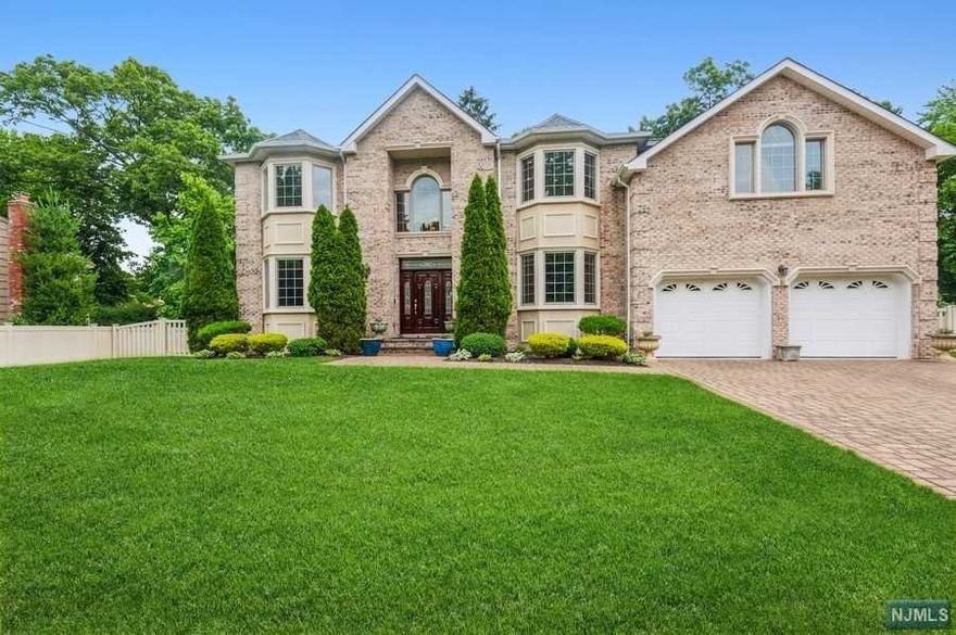Custom built in 2010 this beautifully appointed center hall colonial w/ open floor plan design is located on a quiet street & features on the 1st Fl: entry foyer w/ granite floor & motorized chandelier; living room; sun-filled dining room; gourmet kitchen w/center island, granite countertops, full height custom maple cabinets & top of the line SS appliances including double wall oven, 5-burner cooktop, & warming drawer; separate dining area w/door to private patio & fenced backyard. Spacious family room w/gas fireplace; .5 Bath; Laundry Rm. 2nd Fl: primary bedroom w/2 custom walk in closets, alcove & bath w/ dbl sink vanity, jac. bath & sep. shower; 3 BR; Full bath. Lower Level: 9 FT ceilings, egress windows, plumbed for bath. Andersen windows, hardwood floors, skylights, poured concrete foundation, irrigation system; central vac., paver driveway & more! 12 miles to the GW Bridge and 2 miles to Closter and Tenafly shopping centers.