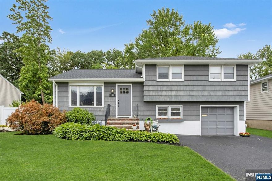 Beautifully Expanded Home with Modern Open Floor Plan in Saddle Brook! Welcome to this move-in ready gem that perfectly blends charm and functionality. As you enter, you're greeted by a sunlit dining room with a large picture window, setting a warm and inviting tone. The heart of the home is the stunning modern kitchen, featuring a spacious center island, granite countertops, rich wood cabinetry, and sleek stainless steel appliancesâ€”perfect for both everyday living and entertaining. Adjacent to the kitchen, the expansive family room boasts French doors, a vaulted ceiling, custom fireplace, built-in shelving, and access to the backyard, creating a seamless indoor-outdoor living experience. A few steps up leads to three generously-sized bedrooms and a beautifully updated full bath. The walk-up attic offers exciting potential for additional living space or storage. The walk-out lower level includes a versatile bonus room with French doors, an updated half bath, a laundry room, and direct access to both the garage and the backyard. Enjoy outdoor living in the lush, spacious backyard, complete with a covered patioâ€”ideal for gatherings, barbecues, or simply relaxing in your private retreat.