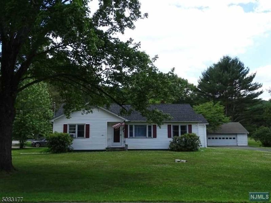 You will love living in this Ranch home on close to 2 acres with all its living area on the first floor. Three bedrooms, 1.5 baths, plus a full unfinished basement. Laundry Rm on main floor. Plus, there is a detached 2 car garage with workshop area. Some finishing touches needed in home but most easily completed. Wall A/C in Dining Room As Is.. Seller will need to lease back home for up to 12 months after closing.