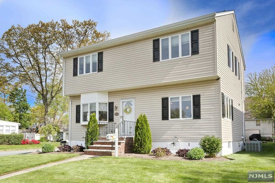 Move right in to this light and bright 3 bedroom, 2 bath colonial home. The first floor features living room open to the den/office, spacious kitchen with dining area, large peninsula, granite counters, stainless appliances and sliders to patio/yard and full bath. The second floor offers large primary bedroom with walk-in closet, two roomy bedrooms with double closets and second full bath. You will love the full finished basement with family room, laundry room with sink and tons of storage. There is much to love about this home including hardwood floors, central air, new roof, newer tankless water heater, beautiful paver patio with gas line to grill and oversized detached garage with loft storage. This wonderful home is ideally located near train, bus, town and in the Traphagen Blue Ribbon school district. Come visit today!