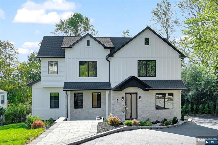 Welcome to this newly renovated 6-bedroom, 5.5-bath home tucked away on a quiet cul-de-sac offering approximately 3300 sq. ft. of thoughtfully designed living space across three levels. Step inside to a sun-filled open layout where oversized windows and hardwood floors set a warm, inviting tone. The spacious living/family room, centered around a sleek fireplace with sliders to a large deck, opens directly to the chef's kitchen, creating a natural gathering space. Just off the kitchen, a bright dining area provides the perfect setting for entertaining or everyday meals. The kitchen boasts a generous center island, premium finishes, and a walk-in pantry. A private office, powder room, and guest ensuite complete the first floor. Upstairs, the primary suite offers a true retreat with a spa-inspired bath, large walk-in closet plus additional storage, and a private balcony. A junior ensuite, two additional bedrooms with a shared Jack-and-Jill bath, and a convenient laundry room complete the second level. The fully finished WALK OUT basement expands the living space with a large recreation room, an office, and a guest suite with walk-in closet and full bath plus direct access to the garage. Located in the sought-after Livingston School District and close to premier shopping, dining, and houses of worship, this home also offers excellent commuter access with nearby train stations, bus service, and major highways including I-280, I-78, and Route 10.