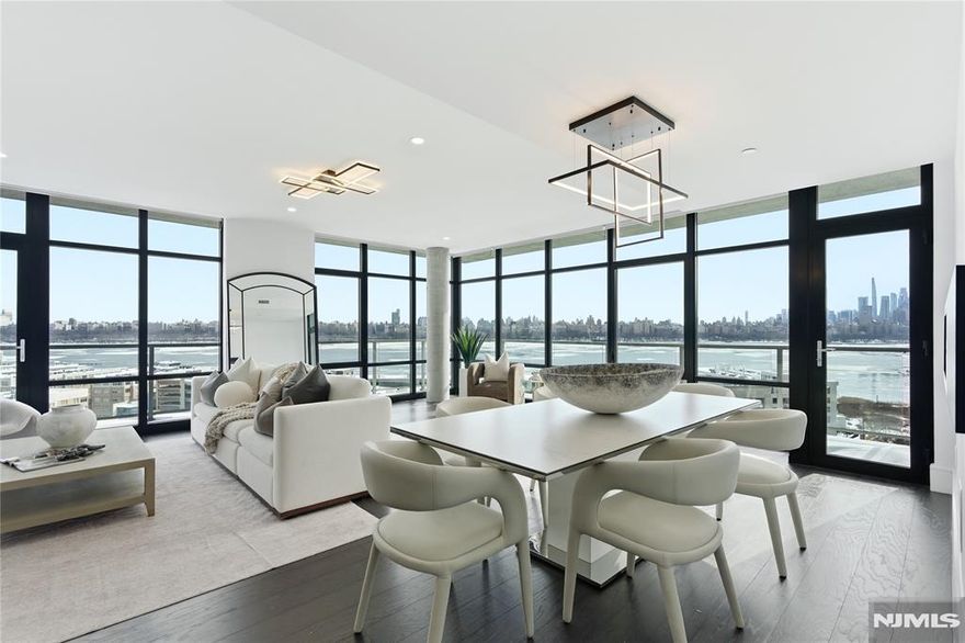 Indulge in unparalleled luxury and breathtaking views at Solaia, where this exquisite 3-bedroom, 3-bathroom condo offers a sophisticated penthouse-style living experience on the 14th floor. Designed for those who appreciate holistic and balanced living, this residence boasts a 55-foot wraparound balcony and dramatic floor-to-ceiling windows, all enhanced by upgraded automatic blinds, providing sweeping vistas of the iconic New York City skyline. The heart of this home is its designer kitchen, a culinary enthusiast's dream, featuring custom Italian cabinetry, SapienStone countertops, a stunning waterfall island, and top-of-the-line luxury appliances. The primary bedroom serves as a serene retreat, complete with a custom closet and a lavish en-suite bathroom adorned with Seedwood tile feature walls, a soaking tub, and premium bidet systems in all bathrooms. Solaia offers an array of wellness-focused amenities across five floors, including a state-of-the-art gym, yoga studio, spa with dry and steam saunas, Himalayan Salt Therapy, a jetted vitality tub, a residents' lounge, and a rooftop deck equipped with BBQs. This is not just a home; it's a lifestyle. Enjoy the convenience of two deeded indoor parking spaces and an unbeatable location with easy access to NYC via ferries from Port Imperial, the Hudson-Bergen Light Rail, and major routes like the George Washington Bridge and Lincoln Tunnel.