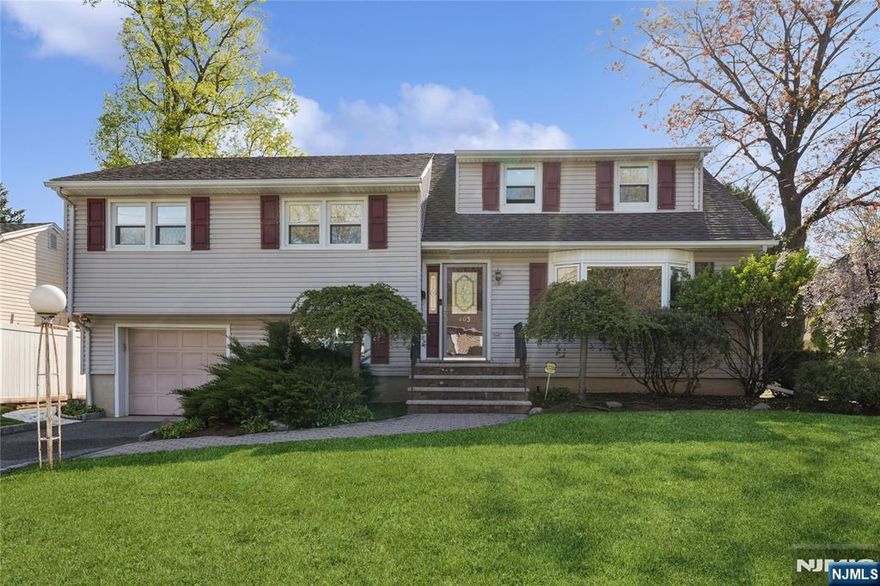 Step into space, comfort, and convenience with this beautifully move-in ready split-level home. Located in the heart of Bergenfield, this home offers five levels of living space, giving you the space you want. Bright and welcoming living room opens to a spacious dining area ideal for hosting, and an updated eat-in kitchen. The second floor features three generously sized bedrooms, a stylishly renovated full bathroom, and a laundry area for added convenience. Just a few steps up, your primary suite awaits with ample closet space and a quiet retreat from the rest of the home. The lower level offers a separate entrance from the garage and includes a cozy den and powder room. Head down to the fully finished basement where you'll find a versatile play area, another full bathroom, and a guest room or workspace. Outside, the large Trex deck and fully fenced-in backyard. Additional features include, two-zone central air conditioning, underground sprinkler system, sump pump & french drains, attached one car garage. All of this in a desirable Bergenfield neighborhood with easy access to parks, schools, shops, and transportation.Donâ€™t miss your chance to own a beautifully maintained home with room to live, work, and play.