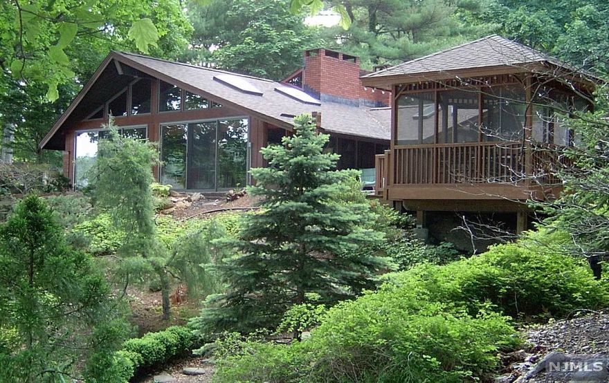 Custom ranch style Lakefront Estate designed by architect extraordinaire Eleanore Pettersen... a student of renowned visionary Frank Lloyd Wright!! Gourmet kitchen with center island & SS appliances, Sub-Zero refrigerator, Wolf gas range, Asco dishwasher, and a beverage refrigerator. Amazing seasonal views from your private dock. Appreciate the integrity of this unique home just as Frank Lloyd Wright always intended in his refined design principles! Original blueprints included with sale of home. Close to major highways, shopping, dining & ideal for NYC commuters... come see for yourself & relax!