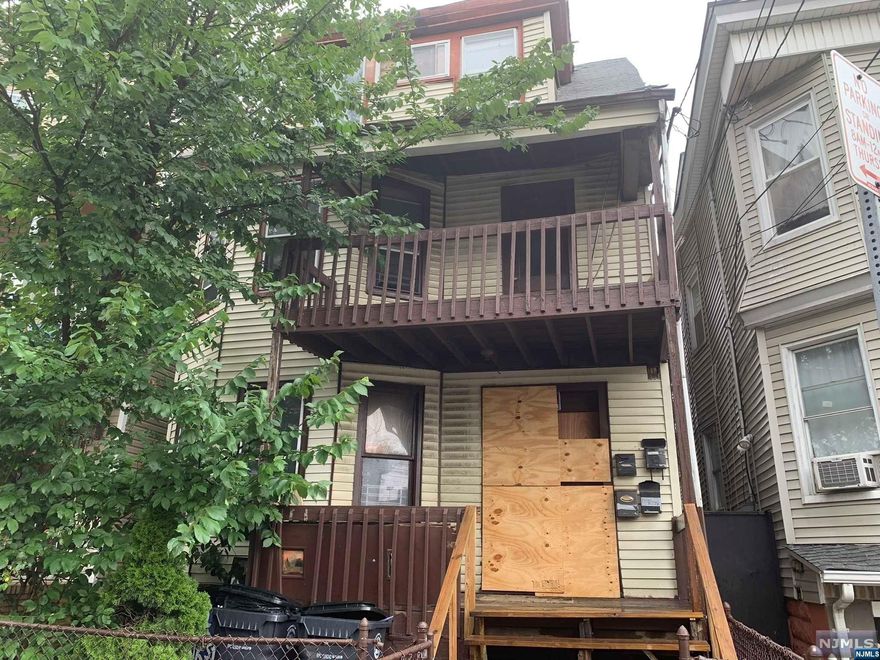 Discover the potential in this two-family house on N 6th Street in Newark. This property features two formal layout apartments, each with a living room and an eat-in kitchen. The first unit includes two bedrooms, while the second unit offers three bedrooms. Both units are ready for a buyer with a vision to update, presenting a prime opportunity to enhance the property's value and appeal. Although there is no off-street parking available, the location offers convenience and potential. Whether you're looking to invest or create a personalized living space, this home provides a solid foundation for your plans. Bring your ideas and transform this property into the home you want and need for the future.