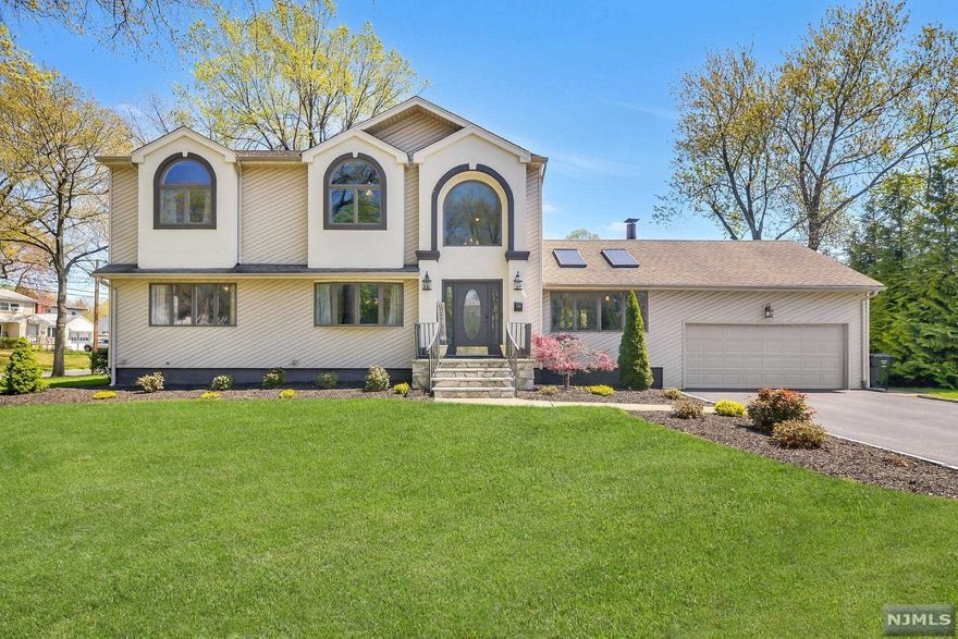 Welcome home! Desirable, quiet neighborhood and move in ready. The 1st floor features a 2 story entry foyer, formal dining room, office/playroom, bedroom, full bathroom. A gourmet kitchen that features custom cabinetry & oven hood, subzero refrigerator, duel draw dishwasher and butler pantry area. Nestled next to the kitchen is the great room with cathedral ceiling, skylights that bring in amazing natural light and a cozy fireplace. The 2nd floor offers 3 bedrooms including the master bedroom, all appointed with cathedral ceilings, large closets and a jack n' jill bathroom. Heading down to the full finished basement you'll find an oversized laundry room, recreation room and storage rooms finished with beautiful trim work and audio video wiring for a media room. Finishing the interior is the 2 car, high ceiling garage with both inside & backyard access. The exterior features mature landscaping and newer hardscaping including a patio and fire pit. Don't miss out, this will not last