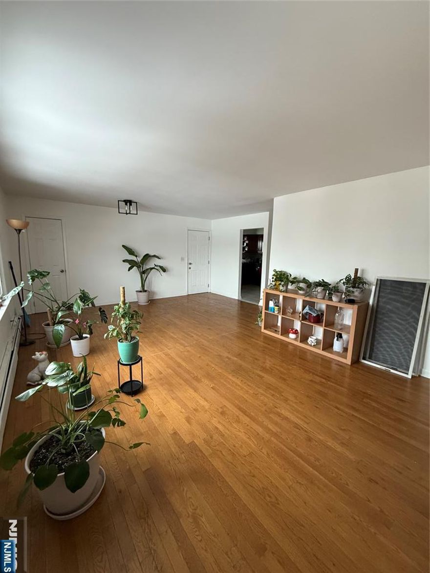 Bright and spacious three-bedroom, second-floor apartment offering comfort and style. Enjoy a modern kitchen with granite countertops and tiled flooring, and beautiful hardwood floors throughout. Parking included for added convenience. Cat-friendly home ideally located near transportation, shopping, and everyday essentials.