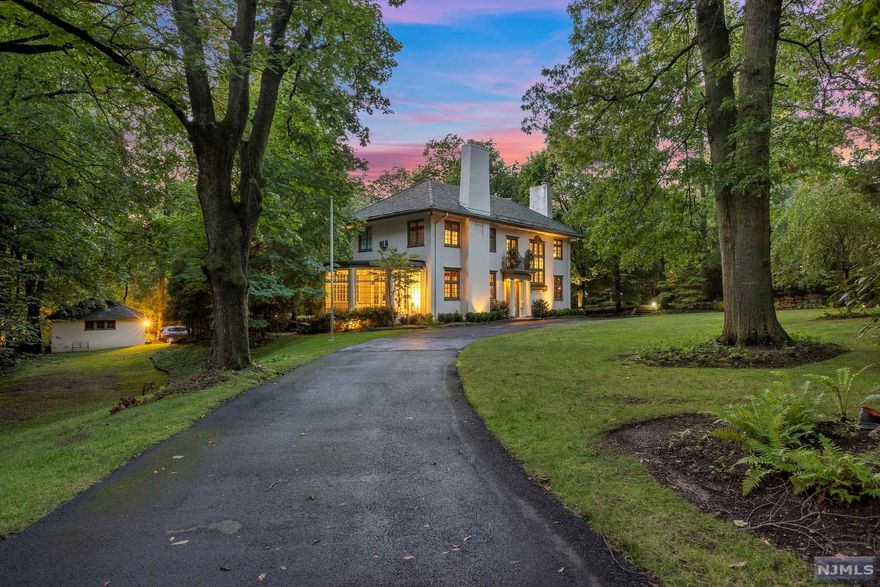 The VIRTUAL TOUR link for this listing contains an enormous amount of relevant information including a comprehensive video tour with hidden features & room dimensions, written description, additional photos, floor plans, and a complete interactive 3D model of the home. Mediterranean colonial, tiled roof features a spacious sun filled entry opening to a formal living room. Main floor features a bright sunroom, library, dining room and powder room. Library and living room feature wood-burning fireplaces.Hardwood floors and exceptional woodwork give tremendous warmth and character.Full basement with separate entrance and half bath. Plenty storage throughout.Detached heated four car garage w/extension for bicycles etc.Mature, well-maintained 0.82 acre property.Prime location, close to all Houses of Worship and downtown Englewood 10 minutes from the GWB.