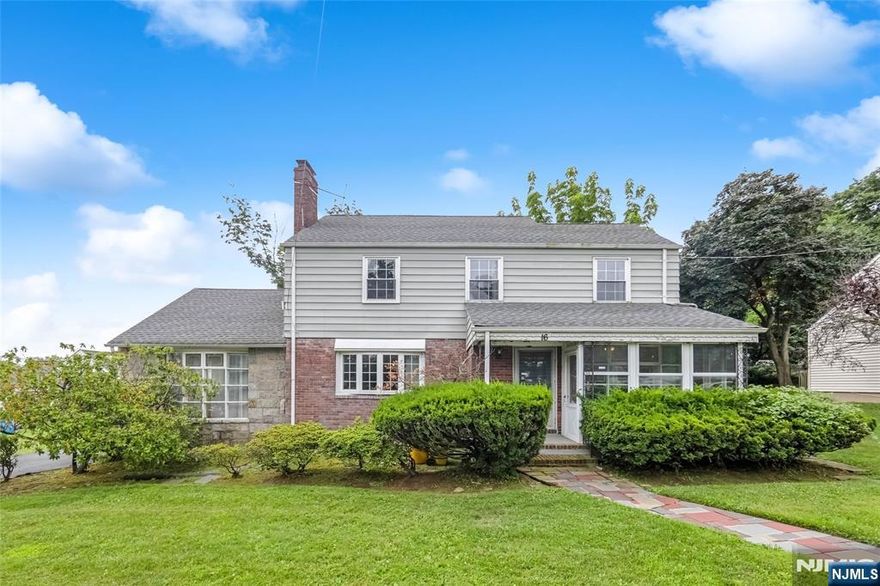 Come see this well-maintained 3-bedroom colonial, situated on a 75x125 lot just steps from local schools, Houses of Worship, and express bus to Port Authority. Main floor offers generously sized formal living and dining rooms, a spacious eat-in kitchen, a large study with fireplace, and sunroom with access to the garage and back patio. Upstairs are 3 well-proportioned bedrooms and 2 full bathrooms, including the primary bedroom with en-suite bathroom. Downstairs is a full, finished basement with wet-bar and plenty of additional storage. Don't miss this opportunity!