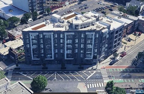 Photo of 338 Newark Ave #204, Jersey City, NJ 07302 (MLS # 25032364)