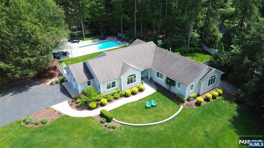 Spectacular location & setting! Renovated 4+ BR home with pool & poolhouse in sought-after San Jacinto Estates in Allendale. Completely redone top-to-bottom in 2014, this sprawling home boasts beautiful hardwood floors, high ceilings, oversized windows & luxurious finishes throughout. Built for entertaining yet practical for everyday living. The main level has a wonderful open floor plan, 4 bedrooms including the primary suite, 2.5 baths, custom office, laundry, mudroom & 2 car garage. The gourmet kitchen with island enjoys views over the amazing private acre grounds. Designed for indoor/outdoor living with a heated pool and incredible pool-house (redone in 2019) with full kitchen, full bath, laundry, huge covered porch, change rooms & bluestone patio. Finished lower level with potential 5th BR, full bath, wet bar, playroom & storage. Nothing to do but unpack. Top-rated school district; Truly the best of one level living! Owner has NJ real estate license.