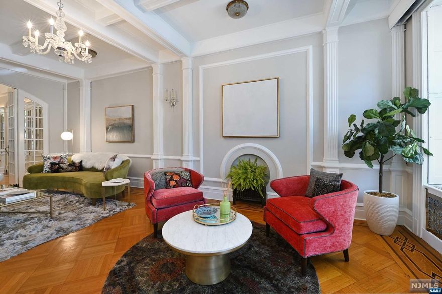 Welcome to 925 Washington Street, a rare and magnificent 22x110' Doctor's Row brownstone filled with old world elegance. This meticulously maintained home has classically designed spaces for modern living. The luxurious living room is appointed with coffered ceilings, decorative trim and plaster moldings, vintage candle sconces, crystal chandeliers and grand double doors. The expansive dining room is a prime space to entertain guests, surrounded by exceptional custom built-in cabinetry with interior lighting and glass doors, original stained glass and decorative fireplace, flowing into a butlers pantry equipped with wet bar and wine fridge. The eat-in kitchen features custom built in seating, stainless steel chef's appliances and stainless and granite countertops. A well designed pantry space serves all your additional needs.