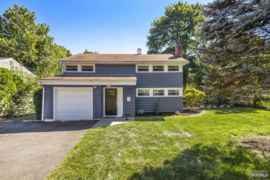 Welcome Home to the Wonderful Town of Waldwick. This Tastefully Renovated 2100 sq ft Colonial Offers 3 Spacious Bedrooms and 2.5 Bathrooms. Master Suite with Walk-in Closet and Private Bath . Gorgeous Galley Kitchen with Quartz Counter Tops and Modern Subway Tile Backsplash and High End Unique Appliances. Central air and Forced Hot Air. Lovely Wood Burning Fireplace in Living Room, Separate Dining Area with Large Glass Picture Window Looking out to the Fenced Yard. The Lovely Leveled Fenced in Yard has Multiple Areas that are perfect for Entertaining. This Home is Truly Turn Key. Close to Schools, Shopping and Public Transportation to NYC.