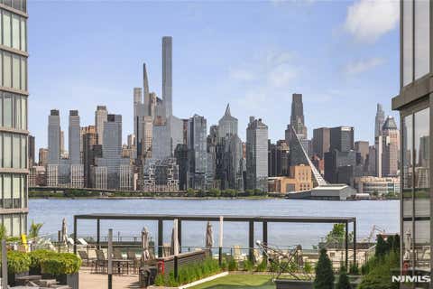 Photo of 9 Ave At Port Imperial #414, West New York, NJ 07093 (MLS # 26018154)