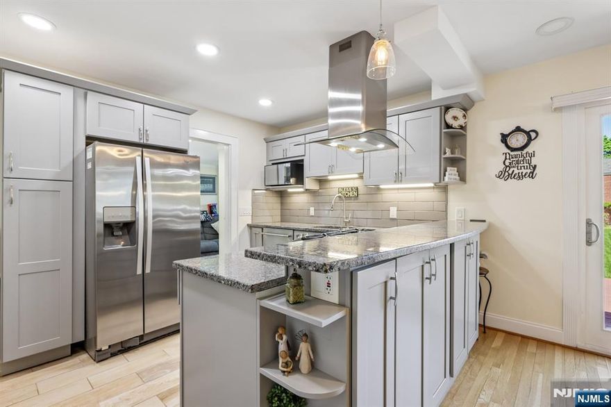 Welcome to this well-maintained home located on a quite tree-lined street with an easy commute to NYC and easy access to major highways. Generous layout features 3 great size bedrooms, 2.5 renovated bathrooms, attached garage, and a full finished basement. First floor features a renovated eat-in kitchen, dining room, living room with wood-burning fireplace, a three-season room with a sliding door to a huge deck, 2 bedrooms and a full bathroom. Second floor features a huge private suite with a walk-in closet and a full bathroom. Additional features are an enormous backyard with a huge shed, attached garage with 3 parking spots and much more. Just down the street you will find elementary and middle school as well as a park. Do not miss out!