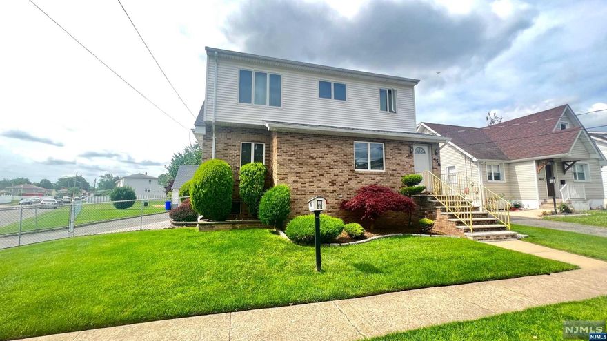 This stunning two-family home, has everything you need for spacious living. It features modern amenities and easy access to NYC transportation. The first-floor apartment boasts an extra-large living room, formal dining room and eat-in kitchen with a large table and access to a beautiful outside deck. There are also two BR, including a king-sized master bedroom w/built-in closets, and a huge bath with a bidet. The 2nd floor apartment has an oversized LR with skylights, a dining room, a large kitchen with a breakfast bar, a king-size bedroom/w customized wall-to-wall closets, modern bathroom. The basement features a summer kitchen, half bath, recreation room, laundry room, and storage space, with a stairway to the 1st Fl. There are also 2 detached car garages, 4 cars parking spaces, and a shed. The home has gleaming hardwood floors, central air, central gas heat.1st floor tenant does have an operating video/audio surveillance system outside.