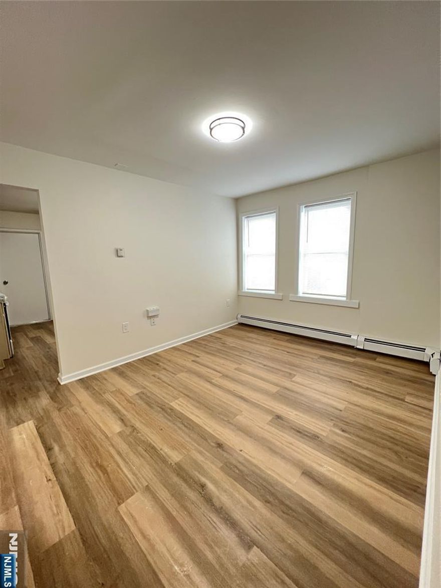 ***Owner is offering FREE first months rent!*** Completely remodeled spacious unit just two blocks walk to Rutherford train station, shops, restaurants, and more! Super easy commute, enjoy all that East Rutherford and Rutherford have to offer. Brand new vinyl flooring, freshly painted, brand new kitchen appliances and countertop, bathroom completely renovated, and high ceilings! Step right in to your brand new unit. Ample street parking with residential permit obtained from Towne. Pets conditional with additional pet security. You won't want to miss this one!