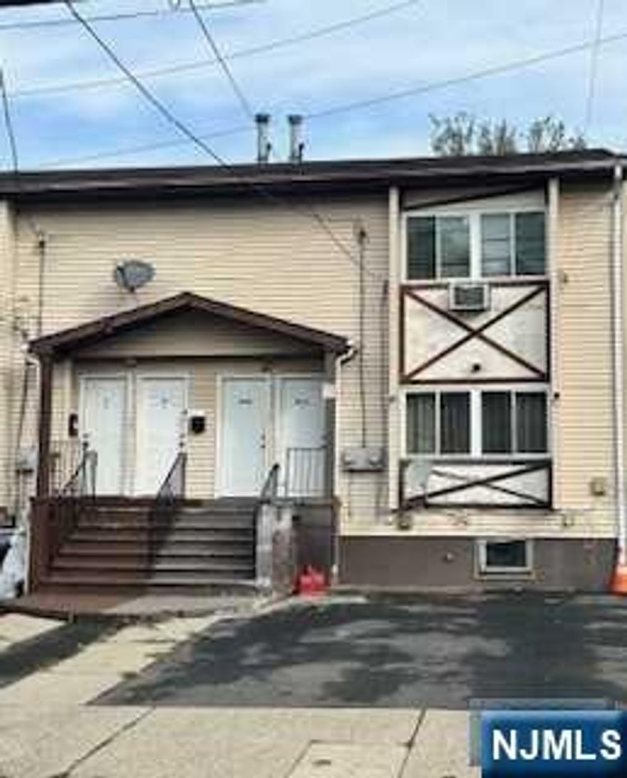 Two family on an up and coming street. one outside parking space for each tenant.