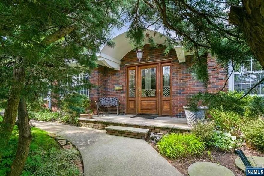 Welcome to your oasis on a spectacular street iin Tenafly. Hidden behind beautiful blooming landscape is a colonial gem. Enter into a gracious foyer with half bath and see straight into your luscious backyard. To the right of the entrance way, is a large dining room that flows to the kitchen and informal family room with wall to ceiling windows and sliding doors. This sun filled room also opens to the kitchen with a bar, 2 sinks and plenty of counter space. On the left side of the entrance way, you will find an over sized formal living room with fireplace and another sun filled large room that can be office/sitting room. 2nd floor has 3 large rooms including primary suite with bathroom, hall bath and laundry. 3rd floor has 2 additional rooms and full bath. Basement is partially finished with half bath and entrance to 2 car garage. Backyard feels like a botanical zen garden. Stunning and elegant home with blue ribbon schools and lower taxes.