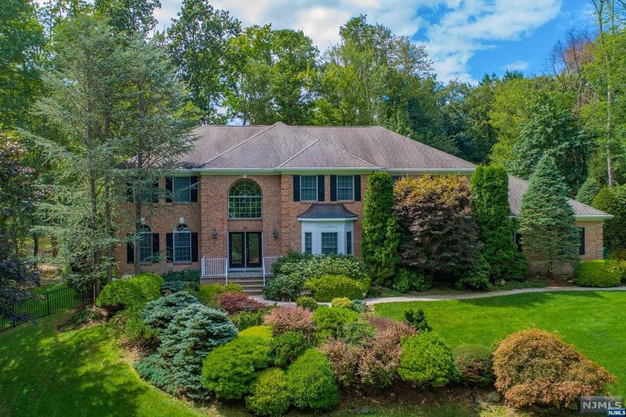 Grand brick Manor set on 1.24 acres of professionally landscaped property in stunning Stone Manor Estates. Enter through the custom doors to a dramatic 2 story foyer. The banquet sized dining room w custom molding is made for entertaining & the 2-story great room w floor to ceiling stone fireplace is the perfect space to relax. The custom eat in kitchen is open to the great room & features high end appliances, large island & granite countertops. The main floor bedroom is fitted with 36" doorways & full bath. A spacious living room & library complete the 1st floor. Upstairs the primary suite features tray ceilings, expansive closet space & a large bath. A 2nd bedroom w ensuite bath & 2 bedrooms w a 3rd full bath completes the 2nd floor. The full finished basement offers a large rec area w wet bar, gym, den & full bath. A resort-style backyard completes the property with saltwater pool, new Trex deck, open yard space & a full house generator.