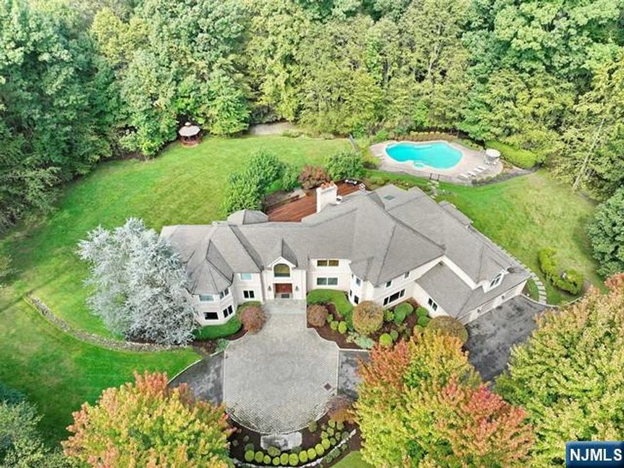 COME AND VIEW THIS SPECTACULAR AND UNIQUE, 7 BEDROOM, 5.5 BATH, CUSTOM COLONIAL STYLE HOME WITH AN OPEN FLOOR PLAN. SITUATED ON A PRIVATE 3.1 ACRE PARK LIKE PROPERTY WITH AN IN GROUND HEATED GUNITE POOL/SPA/STORAGE SHED, AND A GAZEBO AS WELL. APPROX 7200 SQFT. ENTER INTO THE 2.STY GRAND FOYER. FORMAL LIVING RM, LIBRARY/OFF/BUILT INS, BACK STAIR WELL, POWDER RM, BANQUET SIZE FORMAL DINING RM,BUTLER PANTRY,GOURMET EAT IN KITCHEN,OFFICE,2.STORY GREAT RM/FIREPLACE, LAUNDRY RM, GUEST BR,FBTH/SS. THE 2ND.FL.OFFERS A TRAYED CEILING PRIM.BR/DRS TO TERR,HIS&HER WI.CL,SITTING AREA,FBTH/JAC/SS, BR/J&J BATH/BR, BR,BR,FBTH/SOT. THE FULL DAYLIGHT BASEMENT IS FINISHED WITH A LARGE RECREATION RM,PLAY RM/DOORS TO YARD, BEDROOM, FBTH/SS, UTILITIES AND STORAGE. 3 CAR ATTACHED GARAGE. CLOSE TO SCHOOLS, SHOPPING AND PUBLIC TRANSPORTATION. THIS IS A MUST SEE HOME!!