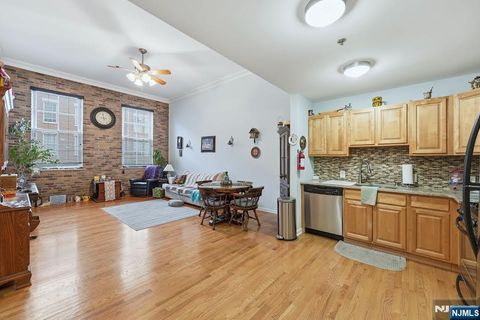 Photo of 19 Market St #205, Paterson, NJ 07501 (MLS # 26018485)