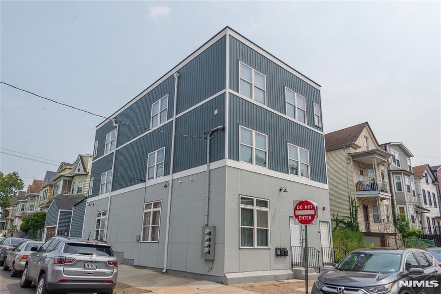 Experience the pinnacle of modern investment with this rare, totally rebuilt 2024 three-family masterpiece. Each of the three expansive units has been meticulously designed for the sophisticated renter, featuring soaring high ceilings, a generous three-bedroom, two-full-bath layout, and the essential comfort of central air conditioning throughout. Every residence is a study in contemporary luxury, boasting premium finishes and the ultimate convenience of dedicated in-unit laundry, ensuring these apartments command top-tier market rents. For the savvy investor, this property offers an exceptional turnkey opportunity with excellent existing rental income and significant upside potential. The financial appeal is further enhanced by extremely low taxes, creating an incredible high-margin investment with minimal overhead. Its location is a commuter's dream, situated moments away from major NYC transportation hubs and primary highways, ensuring a consistent and high-quality tenant pool. Whether you are looking to occupy one unit and have your mortgage paid or add a pristine, low-maintenance asset to your portfolio, this 2024 build represents an unrivaled opportunity in today's competitive market.