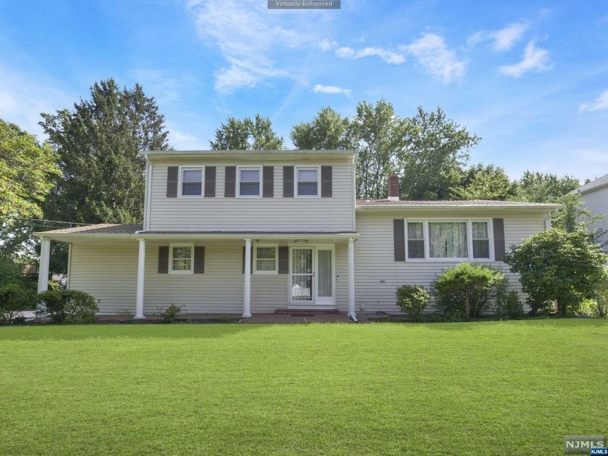 Call or Text Gene at (973)583-3720 for all confirmed showing appointments. Well maintained custom Colonial Split Level. Greet your guests into the entry foyer, which leads to the large new kitchen. Kitchen features granite countertops, custom cabinetry, ss appliances and center island. Sliding glass doors lead to 3 season room. Family room located just off the kitchen. Ground floor full bathroom. Dining Room leads upstairs to the spacious living room. Retreat to the 2nd floor primary bedroom offering 2 closets and en suite with vanity and tall shower. 3 add'l bedrooms and full bathroom. Basement features laundry room and extra storage. Sliding glass doors from the 3 season room lead out to the large patio offering plenty of space for outdoor entertaining. The fully fenced in level backyard features a storage shed. 1-car attached garage and ample driveway parking. Conveniently located near NYC transportation, schools and shopping.