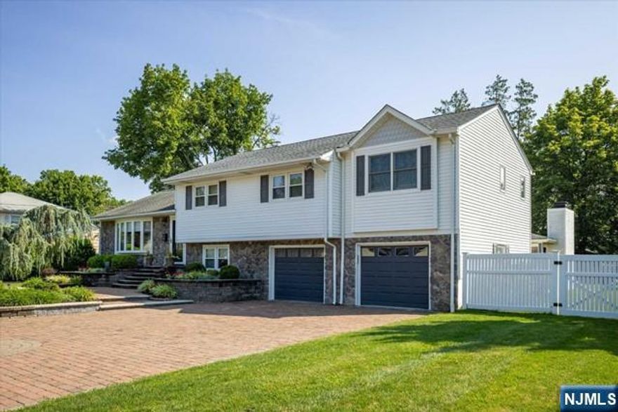 Welcome to your dream home! This beautifully renovated gem has everything you could wish for and more. The heart of this home is undoubtedly the stunning gourmet kitchen, featuring a Wolf 6-burner stove, a beverage area with a wine refrigerator, and a huge island that's perfect for both cooking and entertaining. The primary suite is your own personal retreat, complete with walk-in closets, new full bath with a soaking tub, and a cozy sitting room. Plus, there are two more spacious bedrooms and another gorgeous new full bath on the second floor. Step into the family room, and you'll find it opens up to a backyard paradise. Imagine evenings by the fireplace, enjoying a drink under the pavilion while watching your favorite team, or taking a dip in the heated saltwater pool, all within the privacy of a fully fenced yard. The fully finished basement provides even more living space, whether you need a gym, a playroom, or a home office. With a 2-car gar, professionally landscaped grounds