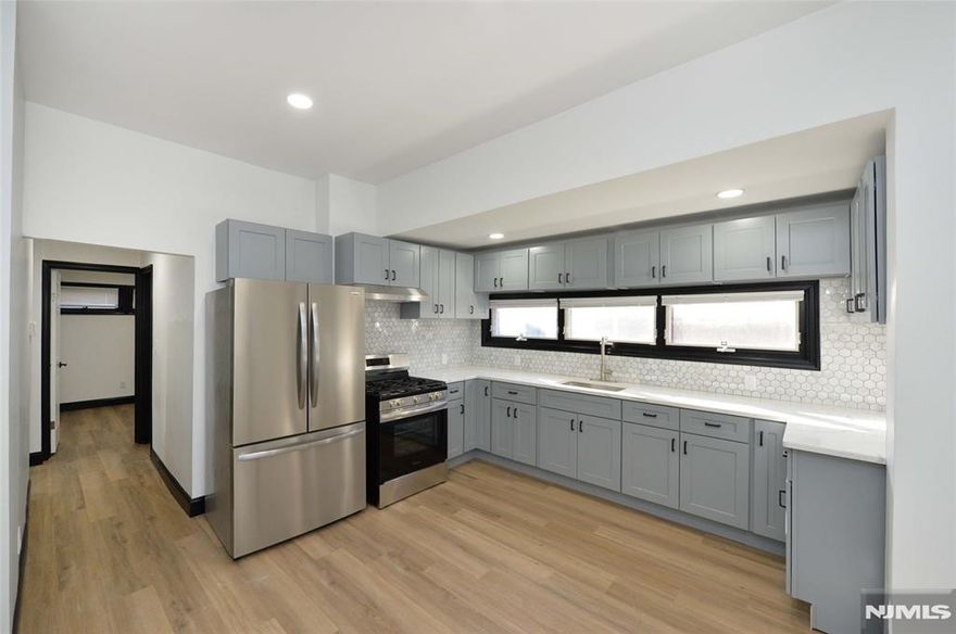 Welcome to this beautifully renovated 3-bedroom, 1-bathroom apartment for rent in Passaic, offering both comfort and convenience. Featuring its own separate backdoor entrance, this home provides added privacy and a welcoming sense of arrival. Inside, you are greeted by a spacious living room filled with natural light, creating an ideal space for relaxing or entertaining. The apartment flows seamlessly into a fully updated bathroom and a well-appointed bedroom, while the eat-in kitchen offers ample room for everyday dining and meal preparation. Two additional bedrooms provide flexibility for sleeping, working from home, or creating a guest space. With thoughtful updates throughout and a functional layout, this apartment combines modern finishes with everyday livability. Conveniently located near shopping, dining, and transportation, this renovated Passaic apartment is a wonderful place to call home.