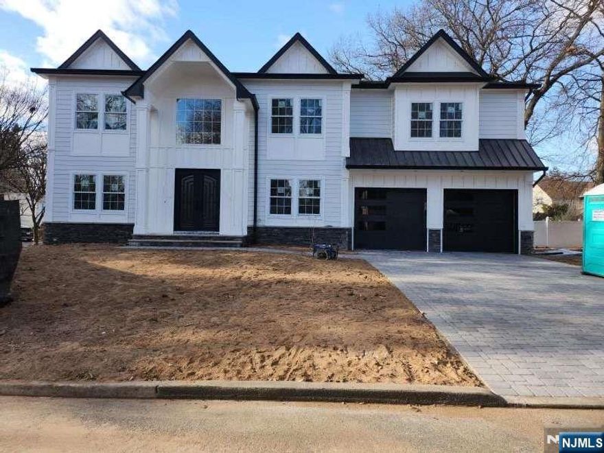 Welcome to this spectacular home in Paramus with gorgeous furnishings, great floor plans offering 6 bedrooms and 5 full bathrooms and 2 half baths. The first floor offers with one half bath in the main level as you enter the foyer with beautiful custom woodwork, spacious gourmet kitchen with waterfall quartz countertop, island countertop, stainless steel appliances, great room with fireplace, living room, dining room with coffered ceiling, and a guest suite with full bath. Primary bedrooms offer fireplaces and walk-in closets, large bathroom with shower and a soaking tub, full finish basement with a media room and bar, and two-car garage.