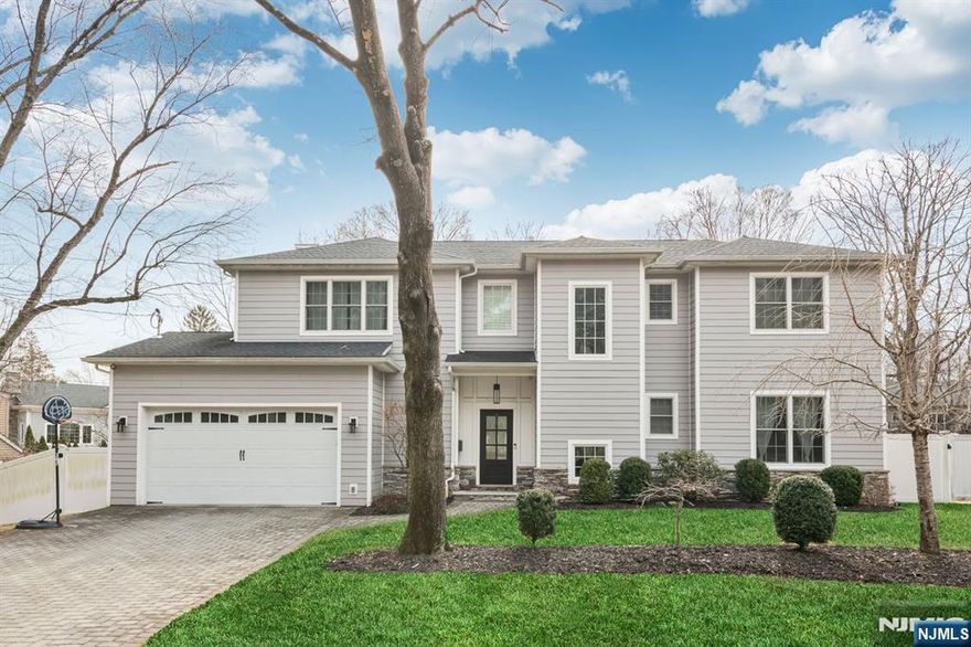 This stunning home, built in 2017 features contemporary finishes and is situated on a generous 0.27 acre lot in one of the most sought-after towns in Bergen County. Upon entering, you will be greeted by a spacious foyer with hardwood floor throughout that seamlessly leads to the open-concept living room with a fire place and a kitchen equipped with high-end appliances perfect for entertaining and everyday living. The large dining area offers ample space to accommodate whether you envision it for a cozy reading nook or music area flexible to suit your needs. The second floor offers a primary suite with his and hers walk-in closets, spacious en-suite bathroom, laundry room and 3 bedrooms with en-suite bathrooms. The basement includes a bedroom with a full bath along a generous space for a playroom, movie viewing area and gym. With its prime location and elegant design, this home offers the perfect blend of luxury and convenience.