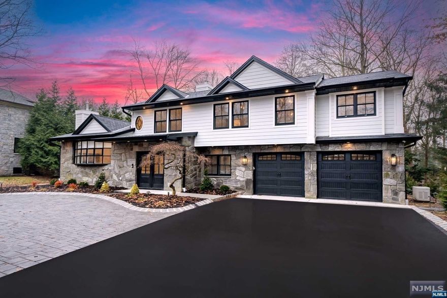 Stunning custom home renovation on one of the most desirable & prestigious streets in the ultimate Closter location. This fully gut-renovated home offers 4 bedrooms & 2.5 bathrooms. Amazing layout on every level. You are welcomed into the entrance foyer with 1 of 2 fireplaces in the home, a bonus room / office space, & very cool mud room / half bath / laundry room. Grand main level with vaulted ceilings in the LR & exposed wood beams. Open-concept dream kitchen with breakfast bar, quartz countertops, & professional grade appliances. Bedroom level offers 4 spacious bedrooms, all with vaulted ceilings. Primary bedroom features amazing en-suite bathroom w. soaking tub, double vanity, & glass shower. 2 fully custom closets in Primary. Fully smart home with so many features including in-ceiling speaker system & a full-house generator. 2 car garage, large driveway, and paver patio in backyard. Oversized 3/4 of an acre lot. You will be thoroughly impressed w this home!