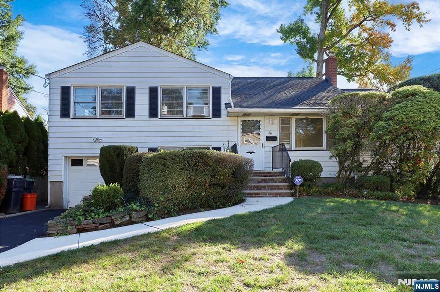 Split Level home in Bergenfield on the border of New Milford on a 65x100 lot ready for you to make your own. The first floor features the living room, dining room, kitchen and a large bonus room. The second floor has three bedrooms and a full bathroom. The ground level has a family room, laundry and access to a 1 car attached garage. The basement is unfinished. Newer roof, hot water and furnace.