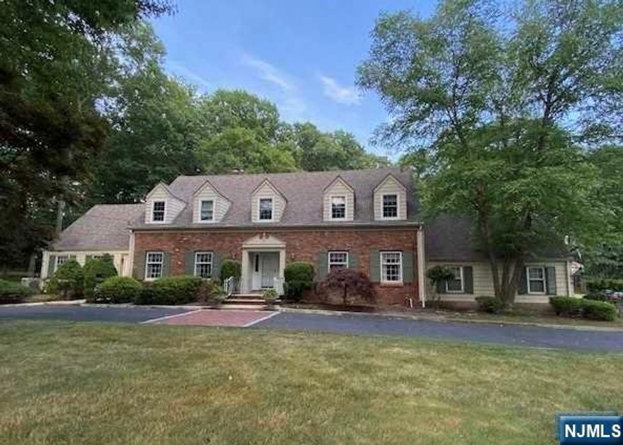 All under one roof! Space galore inside this brick front Williamsburg colonial which boasts a fully outfitted separate apartment with main house access. Set on one of the nicest streets in Ho-Ho-Kus, this estate enjoys 1.63 acres of private, flat shaded property that will have the stress rolling off your back as you pull into the circular drive. Greet guests in the spacious foyer with the perfect circular flow throughout the first floor. L/R with FPL, banquet D/R, F/R with FPL and EIK with sliders to the backyard "boardwalk". Off the kitchen is the laundry area, mud room and the private office space. Second floor has the primary bedroom and bath, a fabulous bonus room, 3 more large bedrooms and a hall bath. Can we talk about the "boardwalk?" 90 feet of glorious entertaining space that segues to the freeform inground pool area. An amazing backyard oasis with room for massive BBQ's or a backyard wedding! A welcoming home for all!