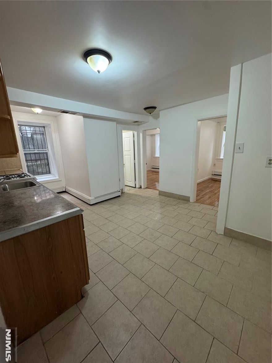 Large, freshly painted 3-bedroom ground-floor apartment conveniently located close to shopping, transportation, parks, and schools. This bright and spacious unit offers comfortable single-level living with generous room sizes and great natural light. Enjoy the added bonus of a private side yard space.