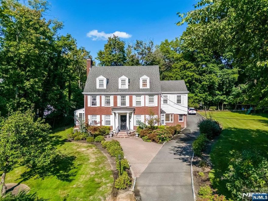 Welcome to 288 Broad Avenue, a stunning center hall colonial on a flat .63 lot in Englewood! This home blends elegance with modern comfort, offering a spacious and versatile layout perfect for both entertaining and everyday living. The first floor has modern kitchen featuring SS appliances, ample cabinetry, and a generous eat-in area. Adjacent is a cozy family room, den, FLR and DR perfect for entertaining guests. The second floor features three well-appointed BR and a full bathroom. The luxurious primary suite has oversized bathroom with jacuzzi, large walk-in closet, and its very own gym. Additionally, a laundry room is located on this floor for easy access. The third floor features two additional BRs and another full bathroom, perfect for family or guests. The finished basement extends your living space with a large playroom, storage and a second laundry option.