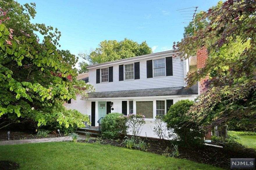 Charming 4 Bedroom/2 Bathroom home in Saddle River on 0.6 acres! Enjoy this approx. 2,200 sq. ft. home as is or complete a renovation to make it your own. 1st Floor - Living Room with wood burning fireplace, large Eat-in Kitchen with bay window, bright Dining Room & spacious Great Room with fireplace that leads out to deck & backyard where mature landscaping gives privacy. Hardwood floors on first level except for the Great Room. 2nd level - 2 large Bedrooms & Bathroom. 3rd level - Master Bedroom with Walk-in Closets, Bedroom & Bathroom. This level could be converted to a luxury Master Ensuite. Laundry Room down a few stairs from the kitchen. Basement has Rec Room & Utility/Storage area. Two-car garage. Three season screened in porch. Low taxes. Approximately 30 miles to NYC. Close to Route 17, shopping & restaurants. Must see!