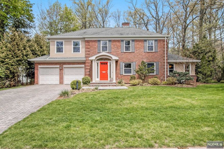 LOCATED ON A BEAUTIFUL TREE LINED STREET, ON THE EAST HILL OF TENAFLY, SITS A 4 BEDROOM, 3 FULL AND 1 HALF BATH SIDE HALL COLONIAL ON A GORGEOUS HALF ACRE OF FLAT PROPERTY. THE HOME HAS INCREDIBLE NATURAL LIGHTING, HARDWOOD FLOORING THROUGHOUT, LARGE FORMAL LIVING ROOM W/FP & DINING ROOM, GOURMET KITCHEN WITH TOP-OF-THE-LINE APPLIANCES AND BREAKFAST AREA FLOWS EFFORTLESSLY INTO THE FAMILY ROOM W/FIREPLACE..ACCESS OUT TO THE PATIO/YARD, MUDROOM/LAUNDRY ROOM, POWDER ROOM AND 2 CAR GARAGE COMPLETE THE MAIN FLOOR. PRIMARY SUITE WITH 2 OUTFITTED CLOSETS AND SPA-LIKE BATH W/RADIANT HEAT, 3 ADDITIONAL LARGE BEDROOMS & 2 FULL BATHS. FULLY FINISHED LOWER LEVEL REC AREA W/HIGH CEILING AND SECONDARY ADDITIONAL LOWER LEVEL FOR STORAGE. EQUIPT WITH A HOUSE GENERATOR. AMAZING LOCATION, NEAR SCHOOLS, HOUSES OF WORSHIP, PARKS AND TRANSPORTAION TO NYC. AMAZING OPPORTUNITY TO LIVE IN THE TOWN OF TENAFLY!!
