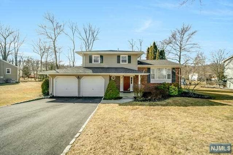Living is easy in this charming and spacious home. The entry foyer with half bath welcomes you to the sun filled cozy family room with wood burning stove and scenic views of the large backyard. With a bedroom or office on first floor living working from home or extended family living is a plus. The main level contains kitchen with great natural light and stainless steel appliances. Main floor is complete with dining room and living room combination. Upstairs has 3 generous size bedrooms and a full bath. Basement is finished with bonus laundry area. Expansive backyard with deck for entertaining. Ideally situated in a quiet desirable neighborhood within minutes from all that Morris County has to offer. **best and final offer by Monday March 7 @12pm**