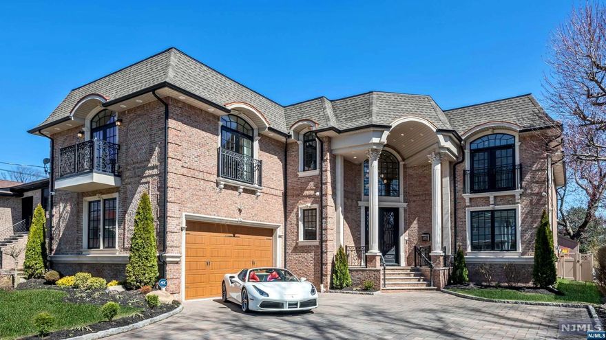 Welcome to this 4 bedroom, 5 full, and 2 half bath all brick center hall colonial located in the sought after Bluff section of Fort Lee. Enter through the foyer to find a formal living room, 2-story great room with fireplace, a sun room overlooking the private backyard, and a bedroom suite with full bath. The gourmet eat-in kitchen is complete with a large center island, separate dining area, pantry, and stainless steel appliances. The second floor primary bedroom suite boasts a luxurious full bathroom with whirlpool tub and steam shower, large walk-in closet, and private terrace. The second floor also includes two additional bedroom suites with full bathrooms, as well as a laundry room. The fully finished lower level is perfect for entertaining with a large recreation area, fitness center, guest room with full bath, wet bar, and a Himalayan salt room.