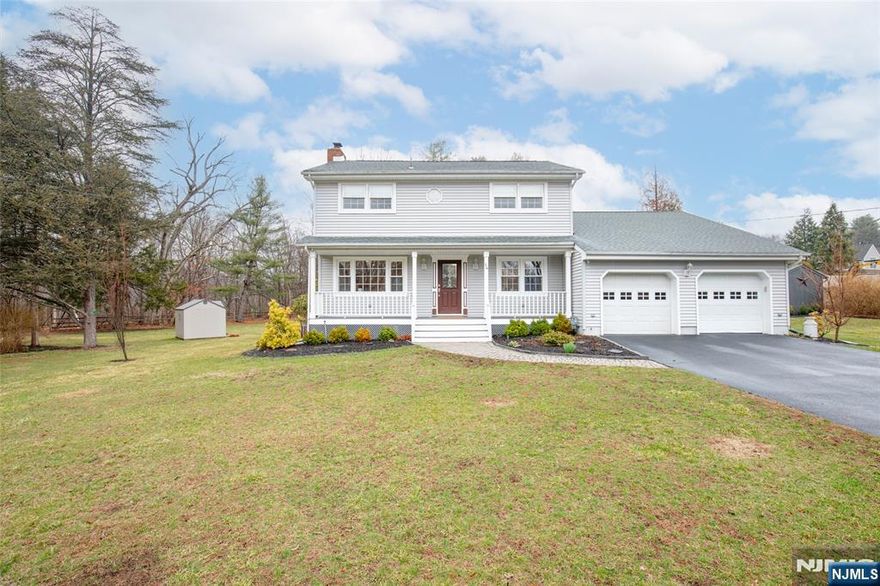 For more information on this home please contact Tommy Kindergan- 201-417-1310 Experience pride of ownership in this beautifully maintained home nestled on a peaceful cul-de-sac along the Ramapo River. Larger than it appears, this inviting property features a classic Trex rocking chair porch, gleaming hardwood floors, and a gas masonry fireplace in the formal living room. The formal dining room flows into a gourmet kitchen with granite countertops, custom cabinetry, tile backsplash, and stainless steel appliances. Enjoy your morning coffee at the breakfast bar or step down to the deck overlooking a park-like backyard with fire pit and shed. The upper level features three spacious bedrooms, an updated full bath, and a serene primary suite with a private full bath. An unfinished basement with laundry and a convenient first-floor half bath and pantry offers plenty of potential. Is this the lifestyle youâ€™ve been searching for?