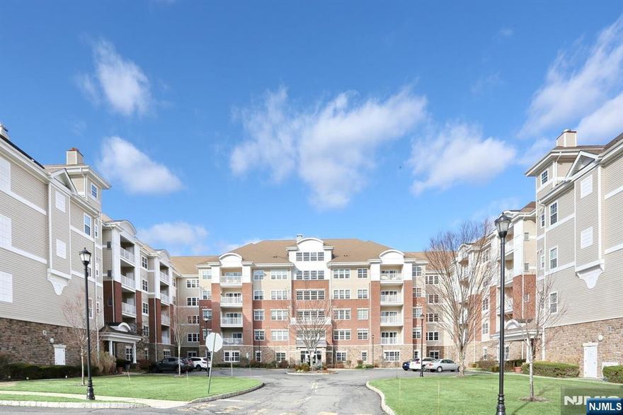 Location, Location, Location! This 1768 sq. ft. Colfax Model is tucked away on the south side of Bldg. 4 presenting you with a few unique amenities. An extra bright laundry room because of the additional window. Lovely meadow views from all your windows and especially your living room which opens up to your private balcony. The apartment is light and airy because of the afternoon sun. The quiet corner entry leads into foyer with hardwood flooring that continues into the Living, Dining & Library Rooms. The Primary and 2nd BR are carpeted, while the Kit & Baths have Ceramic Tile. The Modern EIK is well appointed w/ Medium Colored Hardwood Cabinets & Stainless-Steel Appliances. Granite countertops & Decorative Tile Backsplash. This apartment has been lovingly cared for by this owner for the past 8 years. Wanaque Reserve is the Place to Be in Northern NJ/NY when you are downsizing but, not yet ready to leave the area.