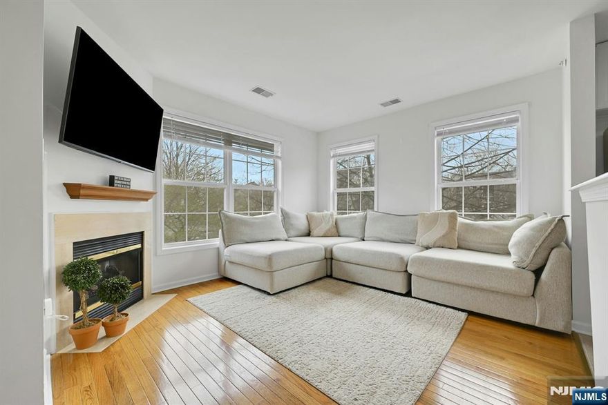 Welcome to this stunning corner unit in the prestigious, gated Cambridge Heights community. This sun-drenched home features a private ground-floor entry leading to an expansive main level with hardwood floors throughout. The open-concept floor plan seamlessly connects the dining area and a bright living room with lots of windows and gas fireplace. Glass sliders lead to a private balcony for a breath of fresh air or head up to the versatile loftâ€”perfect for a home office, or den. The updated kitchen boasts newer appliances and a breakfast bar. The unit offers two spacious bedrooms and two full baths (SOT), the primary is en-suite. Convenience is key with a full size laundry in unit and pantry. Residents enjoy resort-style amenities including a fountain, clubhouse, fitness room, and a beautiful outdoor in-ground pool, all within steps in a gated environment. Located minutes from Route 23, you are perfectly positioned for easy commuting, shopping, and dining. Best of all the seller will pay the balance of the stairs assessment offering you a worry-free transition into this amenity-rich lifestyle. This is the perfect blend of comfort, style, and convenienceâ€”close to everything your heart desires! BEST AND FINAL APRIL 21ST.