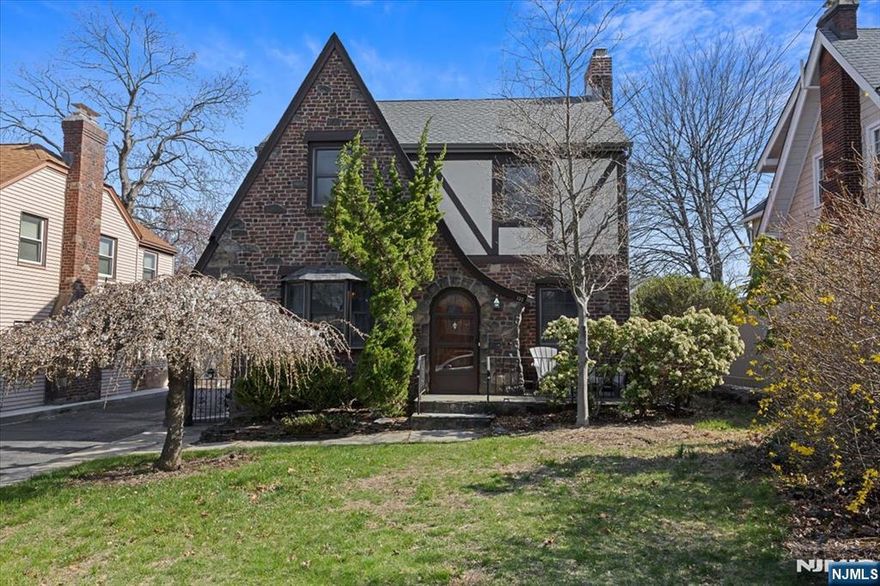 A Tudor Gem Waiting for Your Touch! This charming, bright and sunny, Tudor-style home boasts hardwood floors and original woodwork. Imagine sitting in the sun filled dining room or entertaining in the family room that features a large window that frames the backyard. Ascend the staircase, admiring the original wrought iron railing, to discover four well-proportioned bedrooms. The unfinished basement provides ample storage. New Roof, Gutters, Chimney Liner and Crown by the current owner. New windows in Attic and Basement. New Hardwood floors in Family Room and Bedroom. Shared driveway see survey. 1 Car Garage. With great bones and timeless character, this Tudor is ready to make it your own. Donâ€™t miss this opportunity to live in Leonia, call today for an appointment!